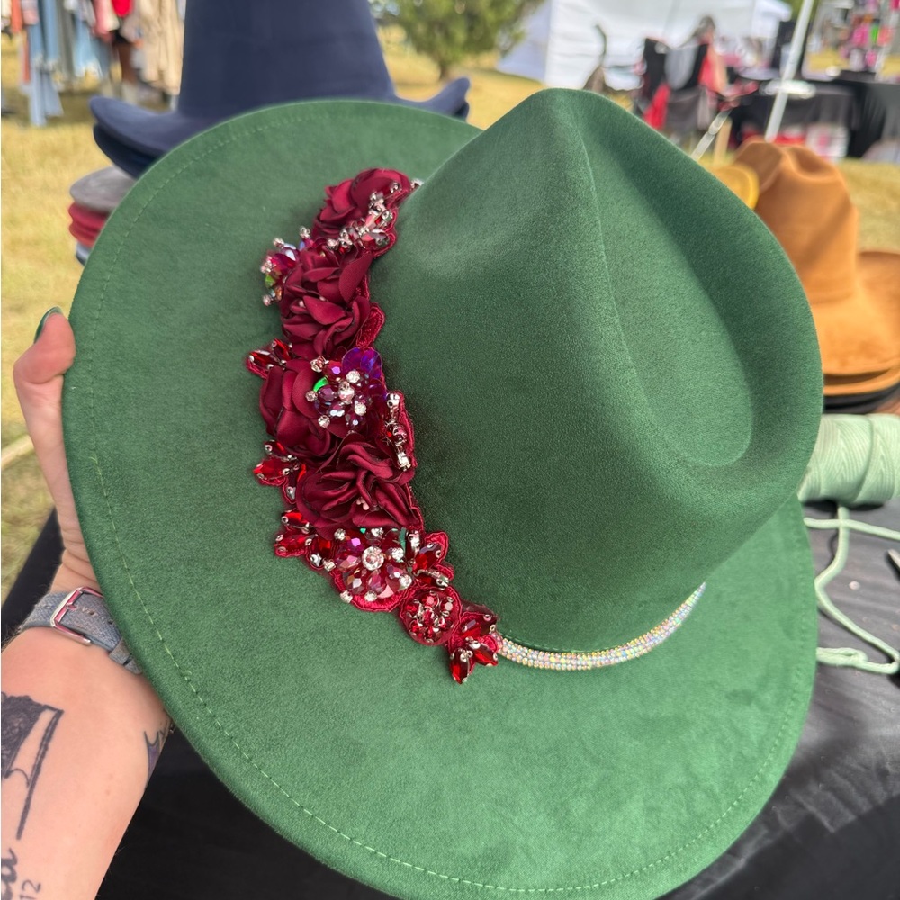 Elegant Green Hat with Red Floral Accent